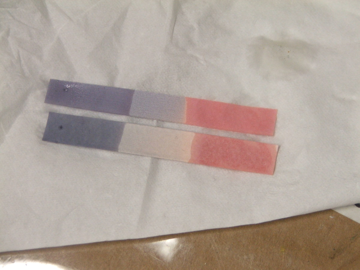 Litmus paper dipped in acid turns red (right of strip) and dipped in base turns blue (left of strip).