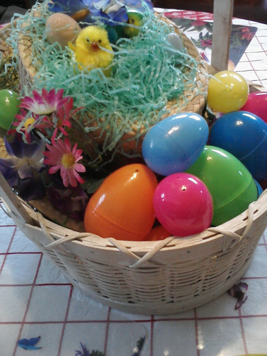 Easter Basket with eggs, chicks, and flowers
