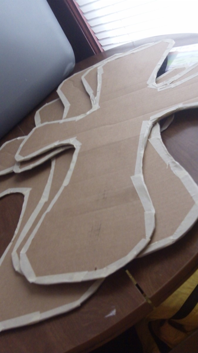 Trace shape on to cardboard, cut out four crosses.  Tape off edges with masking tape to smooth out.