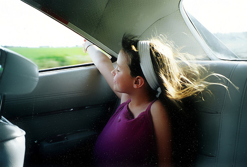 Riding in the back seat!  Good times!