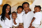 A loving African/American couple with kids