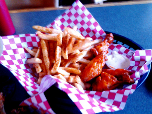 French fries and some of the chicken wings.