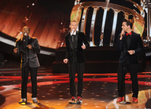 From left, Burnell Taylor, Devin Velez and Lazaro Arbos perform on "American Idol."