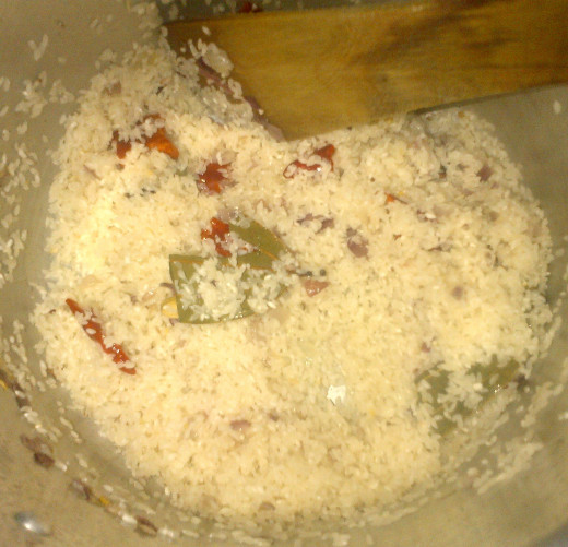 Rice getting fried along with rest of the ingredients