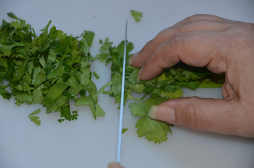 Cut cilantro in small rows from the top of the leaves.  