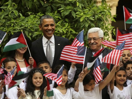 President Barack Obama poses with Palestinian kids during a visit to the Church of the Nativity with Palestinian President Mahmoud Abbas in Bethlehem 