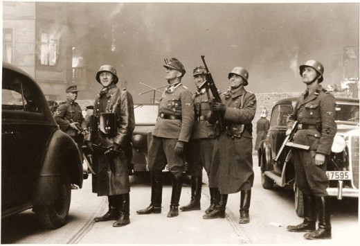 These are men that reported to Heinrich Himmler.  It is amazing that an idea can grow and permeate to this degree.  Original caption read, "The leader of the grand operation."  SS General Jürgen Stroop is at center left (looking up).  