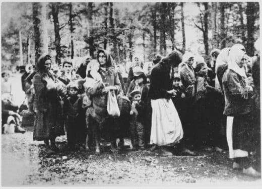 Yugoslavian women and children in a wooded area, about to get deported.  It is hard to fathom what they went through.  