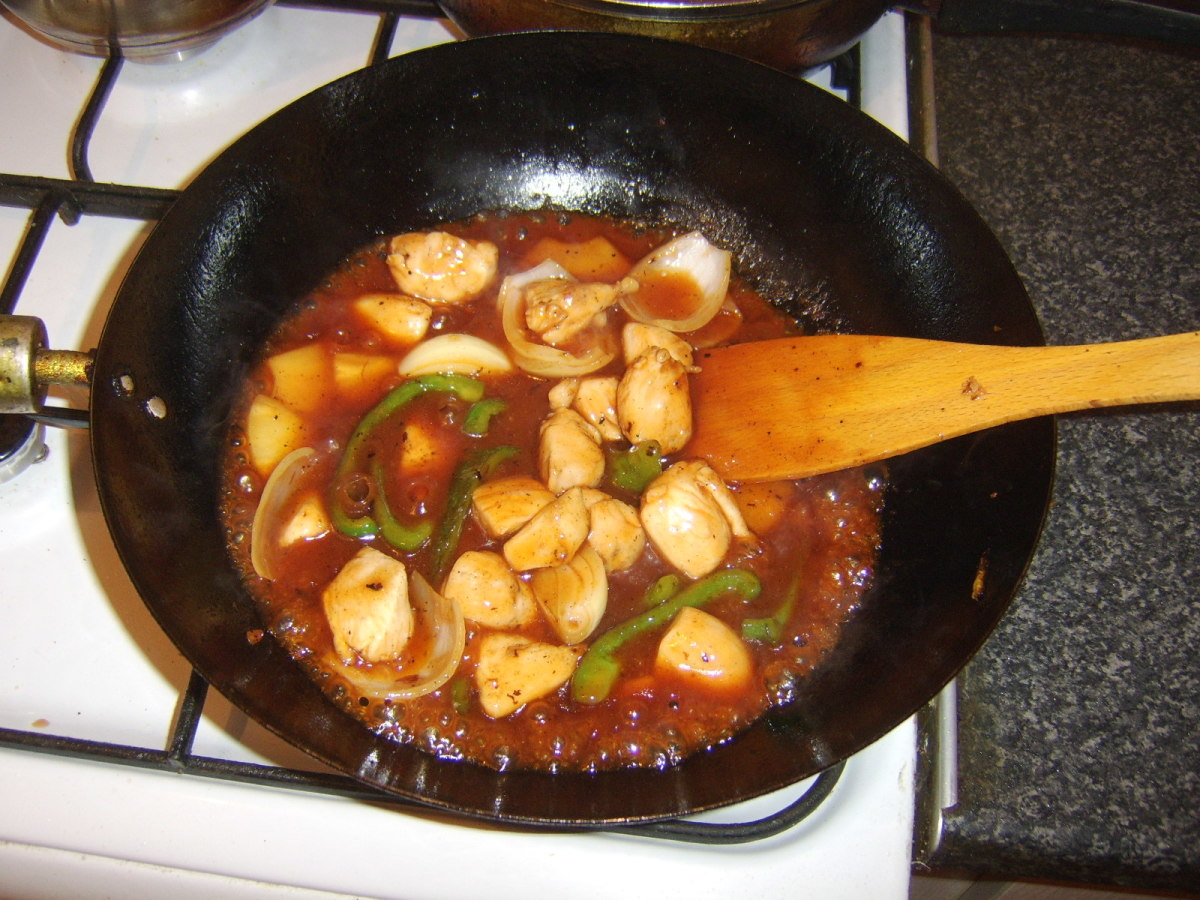 Sweet and sour sauce is added to wok last of all