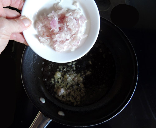 once oil and butter is sizzling, add shallots to pan