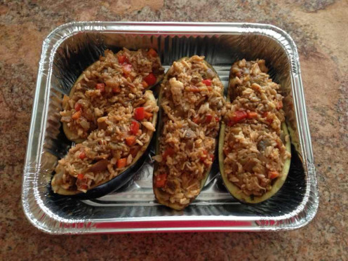 Adding stuffing to the eggplant