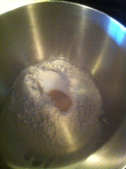 Ingredients for sourdough crust. Wet stuff on bottom, followed by flour and other dry stuff, yeast in the middle