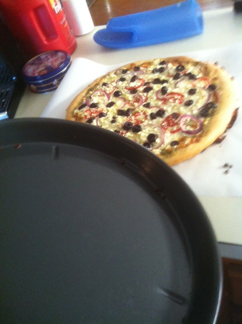 The baked pizza literally slides out of the pan, thanks to olive oil and USA Pans pizza pan.