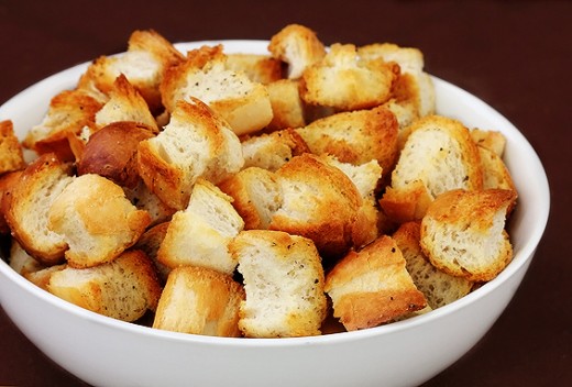 Croutons can optionally be added in Greek salad, to provide texture and absorb the olive oil.