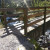 Close up of the wood bridge with rails and the sunshine. Close up of the wood bridge with rails and the sunshine.