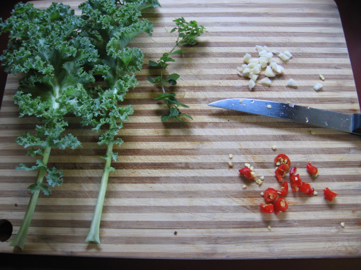 Organic kale, garlic and chili peppers
