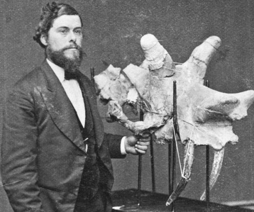Cope alongside a Uintatherium skull.