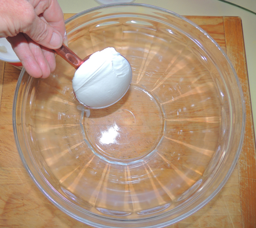 in large mixing bowl, start wet mix with sour cream