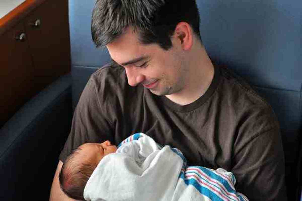 www.flickr.com  Father with new baby