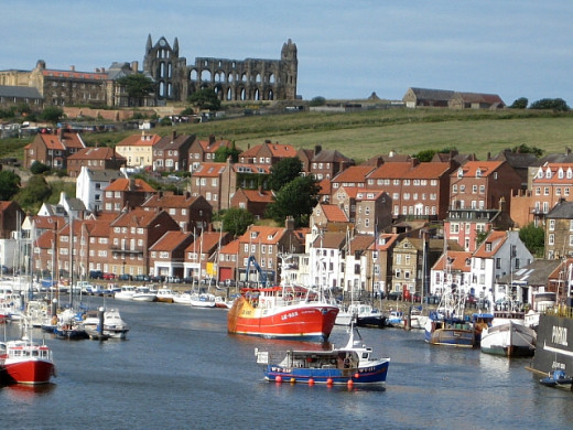 A fine view of Whitby. The abbey and church are on the hill above the houses.