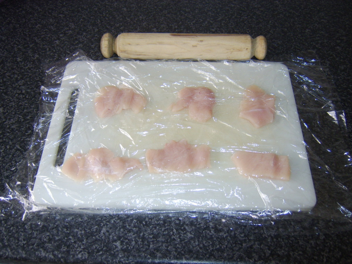 Chicken pieces have been gently pounded to flatten