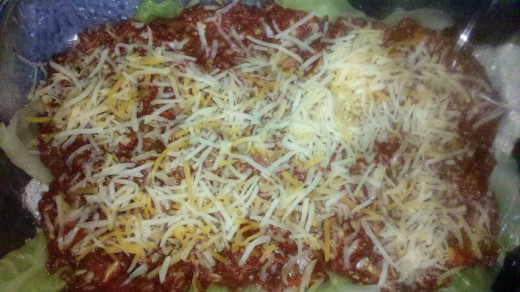 Each layer of Irish Lasagna has cabbage, sauce and cheese.