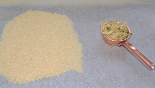 Place parchemnt paper on counter top, and sprinkle the remaining cup of Panko onto a half of it, leaving one side clear to align finished cakes 