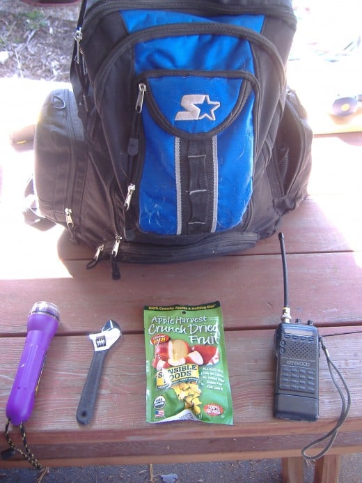 Here are a few of the things to keep in a supply kit: Flashlights (with batteries), Tools, food, and a two way radio (if available).  Put these items in the bag and you're ready to go.