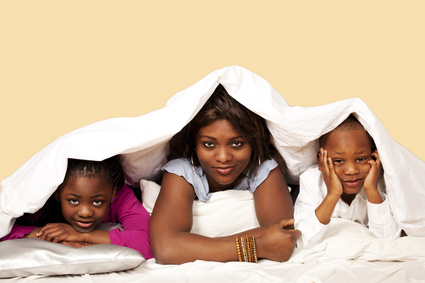 Make sure you are comfortable on your child's new mattress, as well. Photo Credit: Sanjay Deva - Fotolia.com