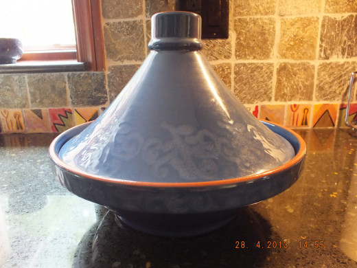This is a Moroccan cooking vessel, called a tagine. Mine is used for decoration. It's too pretty to cook in!