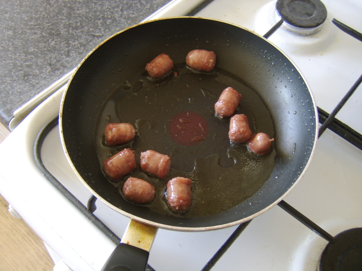 Browning sausage pieces in oil