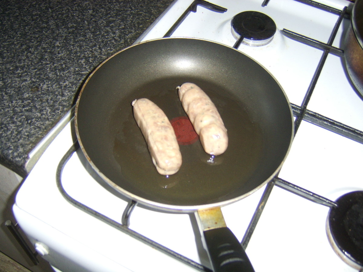 Frying the pork sausages