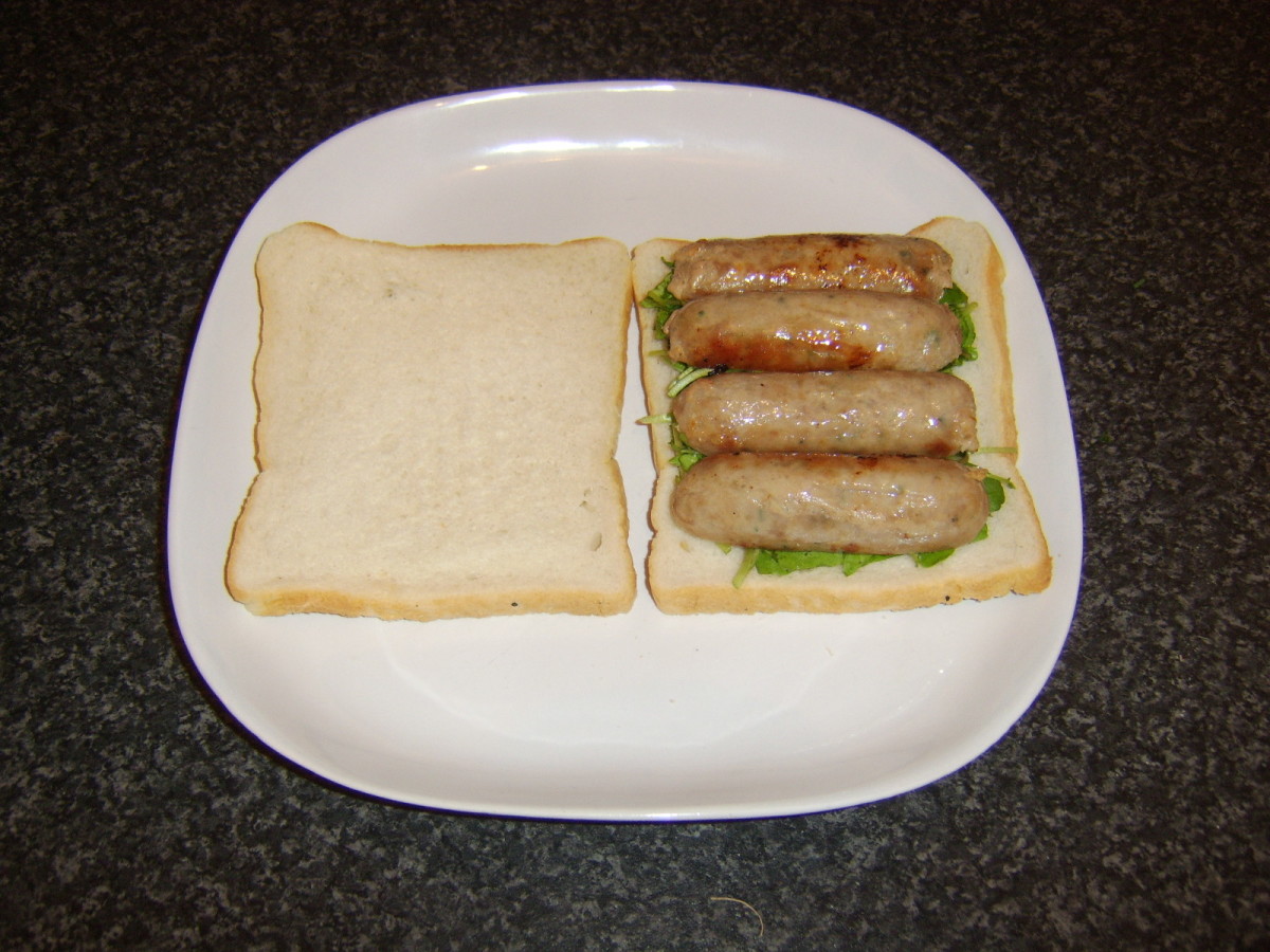 Sausages laid on watercress