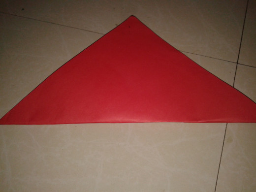 Another square sheet folded diagonal-wise