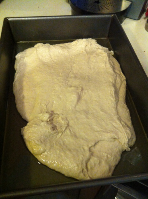 Once the dough is in the pan, press it out to the edges making it even.