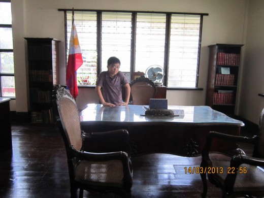 President Garcia's desk in the museum. My nephew Martin is posing beside the desk.