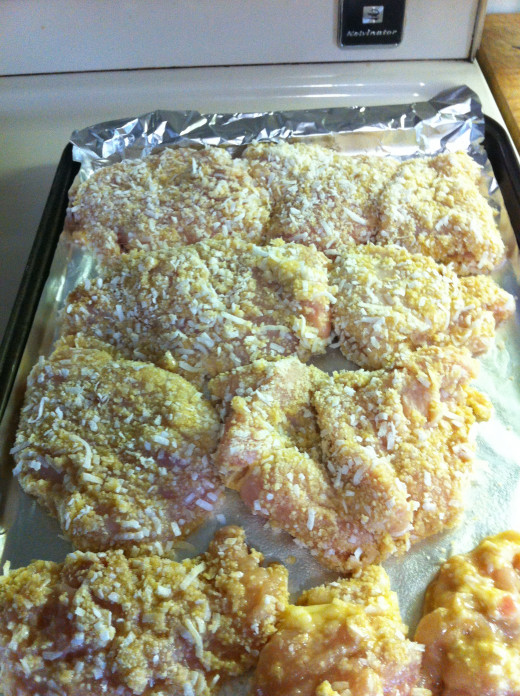 Place each chicken breast onto the foil on the baking sheet
