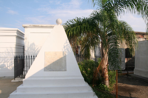 The Varney tomb has a distinct pyramid shape making it visible in early aerial photographs- it was "dead" center of the cemetery. After the dramatic reduction of the graveyard's size, it now sits just inside the front gate.
