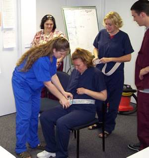 Here we have a group of nursing students training to become certified nursing assistants. 