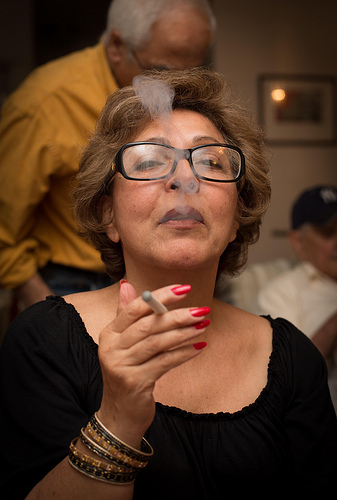 woman with e-cig. no smoke, no smell and no need to go outside to smoke.