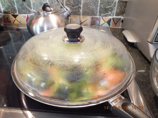 Clamp down the lid and let the veggies steam for a few minutes until the broccoli is bright green.