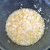 Soaking coconut in lemon glaze mixture. Soaking coconut in lemon glaze mixture.