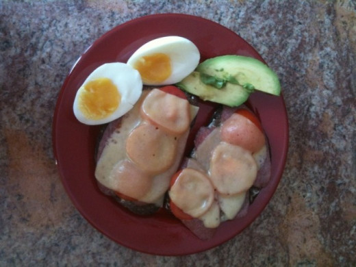 Rye Bread Sandwich with Salami, Tomato, Melted Cheese with Hard Boiled Eggs and Avocado Slices...