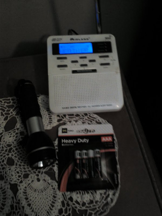 Once you select your safe place, it is important to equip it with vital essentials.  A weather radio, flashlight, and batteries are the first items to add to any safe room.  