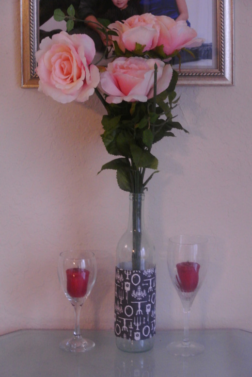Reuse glass bottles like wine bottles as vases. I have several wine glasses and baby jars so I use some of them as candle holders.