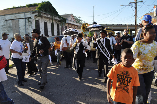 Second Lines truly are celebrations- cheerful for the most part, with dancing and singing to honor the dead.