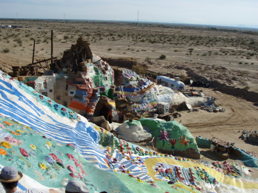 In a dry and weary desert, a beacon of color, love, and imagination greet travelers and pilgrims
