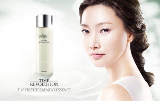 An advertisement for Missha's Time Revolution First Treatment Essence - a dupe of the SK-II product.
