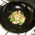 Pineapple, green beans and seasonings are added to stir fried pork