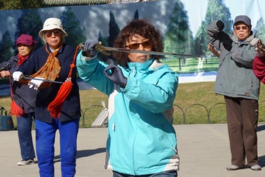 4 c) Retired Chinese doing Sword Dancing Tai Chi on Temple of Heaven grounds
